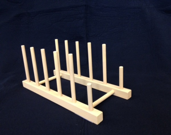 Unfinished custom wooden plate rack display, available in bulk for manufacturers and high-volume production.